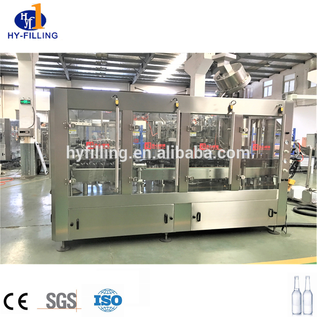 Máquina de llenado de CSD para botellas de vidrio tipo rotativo 3 en 1